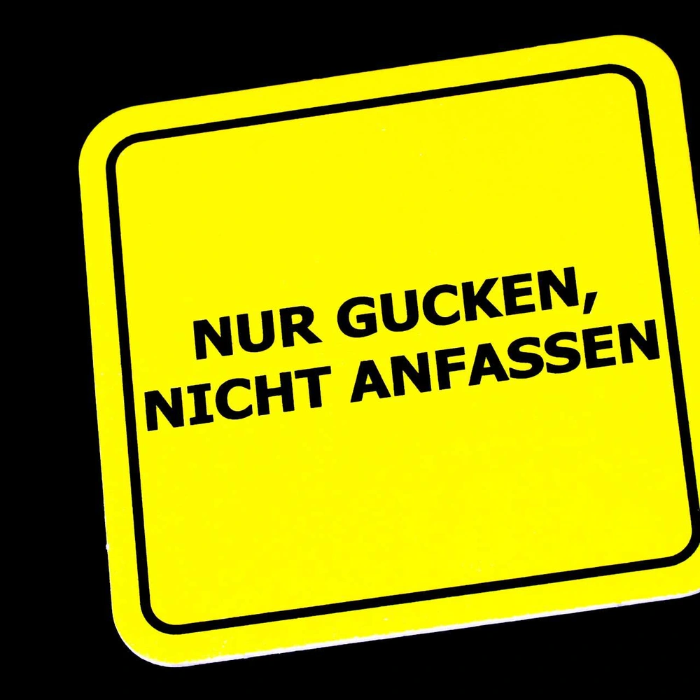 Ein Schild auf dem steht: "Nur gucken, nicht anfassen".